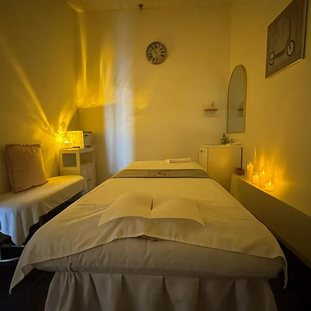 Front desk and reception area of the V Spa with a glowing sign